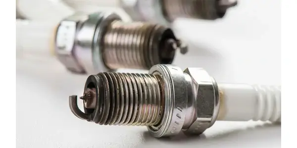 What causes a spark plug to foul?